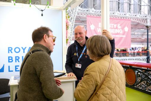 Image of a fundraiser in conversation with supporters